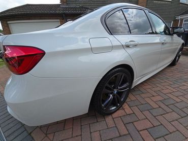 Rear 3/4 of white BMW 320 polished and detailed by AM Auto Aesthetics