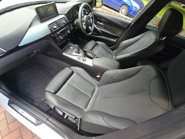 BMW interior view from passenger side door open