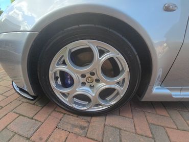 Wheel and caliper of grey Alfa 147 Evoque cleaned by AM Auto Aesthetics