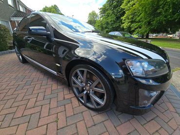 Front 3/4 of black Holden Bathurst with restored shine after valet by AM Auto Aesthetics
