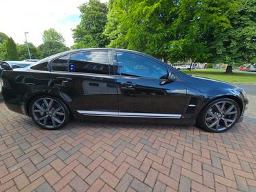 Driver side of black Holden Bathurst showing gloss and clean finish