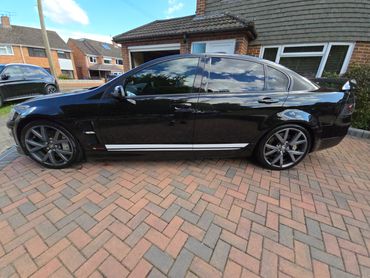 Passenger side of black Holden Bathurst showing polish and tyre shine