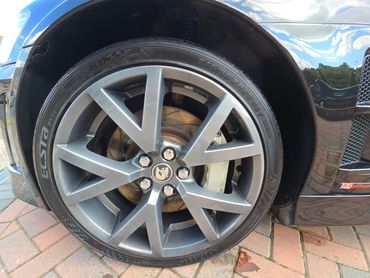 Wheel and caliper of black Holden Bathurst cleaned by AM Auto Aesthetics