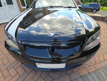 Front of black Holden Bathurst showing gloss after polish by AM Auto Aesthetics