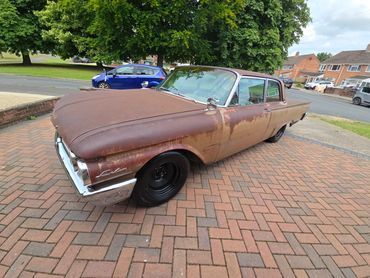 Front 3/4 of Ford Fairlane 500 with restored metal shine after valet by AM Auto Aesthetics