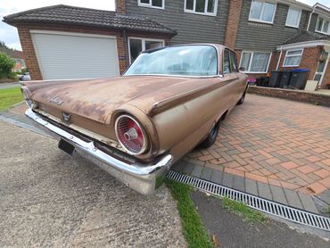 Rear 3/4 of Ford Fairlane 500 showing metalwork symmetry after detail