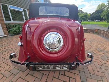 Rear of red Alvis TA14 with boot gloss and clean exhaust finish