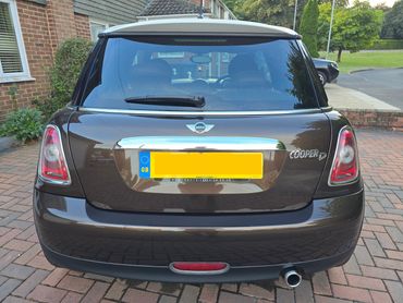 Rear of brown Mini Cooper with boot gloss and clean exhaust finish