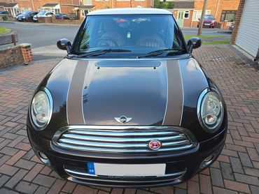 Front of brown Mini Cooper showing gloss after polish by AM Auto Aesthetics