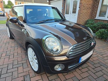 Front 3/4 of brown Mini Cooper with restored shine after valet by AM Auto Aesthetics