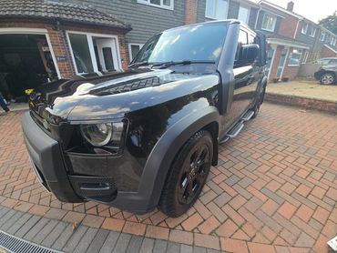 Front 3/4 of black Range Rover Defender polished to gloss by AM Auto Aesthetics