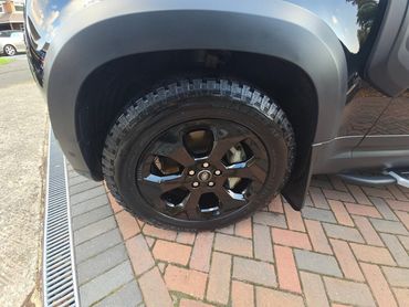 Wheel and caliper of black Range Rover Defender cleaned by AM Auto Aesthetics