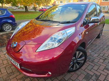 Front 3/4 of red Nissan Leaf polished to gloss by AM Auto Aesthetics