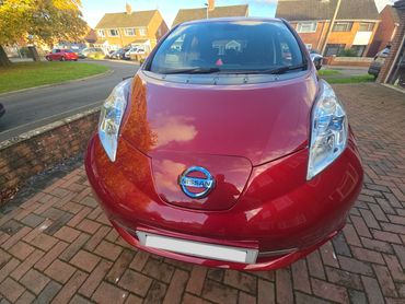 Front of red Nissan Leaf showing gloss after polish by AM Auto Aesthetics