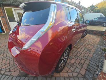 Rear 3/4 of red Nissan Leaf polished and detailed by AM Auto Aesthetics
