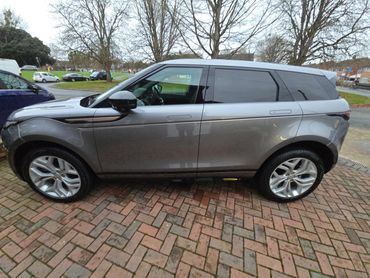 Driver side of grey Range Rover Evoque showing gloss and clean finish