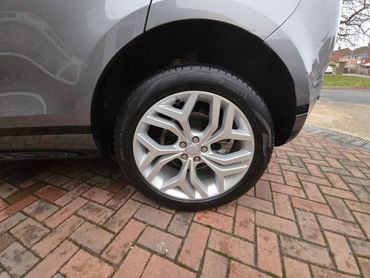 Rear pasenger side wheel and caliper of grey Range Rover Evoque cleaned by AM Auto Aesthetics