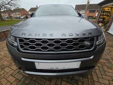 Front of grey Range Rover Evoque showing gloss after polish by AM Auto Aesthetics