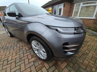 Front 3/4 of grey Range Rover Evoque with restored shine after valet by AM Auto Aesthetics