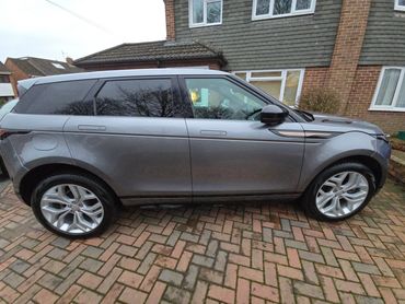 Driver side of grey Range Rover Evoque showing gloss and clean finish