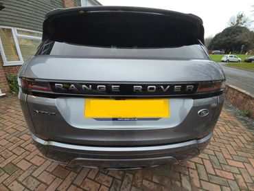 Rear of grey Range Rover Evoque with boot gloss and clean exhaust finish