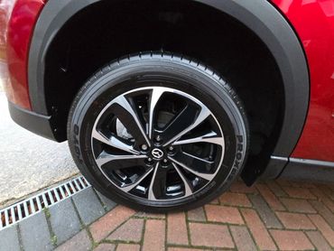 Wheel and caliper of red Mazda CX-5 cleaned by AM Auto Aesthetics