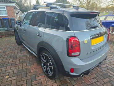 Rear 3/4 of grey Mini Cooper showing paintwork symmetry after detail