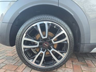 Rear wheel and caliper of grey Mini Cooper cleaned by AM Auto Aesthetics
