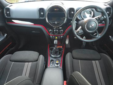 Interior of grey Mini Cooper both passenger seats and dash after interior valet