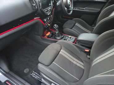 Interior of grey Mini Cooper from passengers’s side after interior valet