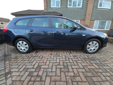 Driver side of blue Vauxhall Astra showing gloss and clean finish