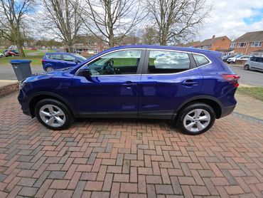 Passenger side of purple Nissan Qashqai showing polish and tyre shine