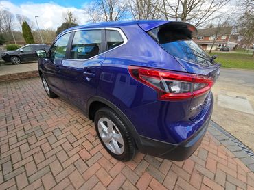 Rear 3/4 of purple Nissan Qashqai showing paintwork symmetry after detail