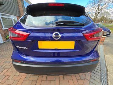 Rear of purple Nissan Qashqai with boot gloss and clean exhaust finish