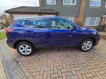 Driver side of purple Nissan Qashqai showing gloss and clean finish