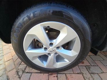 Wheel and caliper of purple Nissan Qashqai cleaned by AM Auto Aesthetics