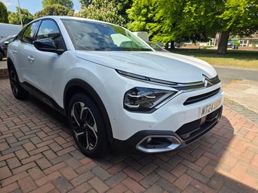 Front 3/4 of white Citroen C4 with restored shine after valet by AM Auto Aesthetics