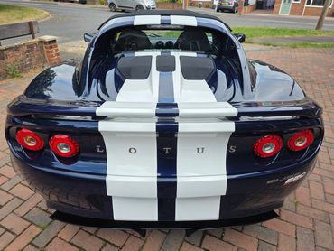Rear end of Lotus after full Revive and machine polishing, with clear reflections on the boot lid.