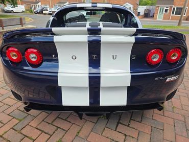 Rear end of Lotus after full Revive and machine polishing, with clear reflections on the bumper