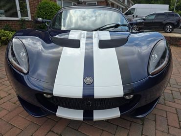 Bonnet and front end of Lotus showing deep gloss and paintwork reflection.