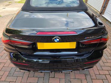 Rear end BMW 440i after full Revive including machine polishing, with clear reflections on the boot