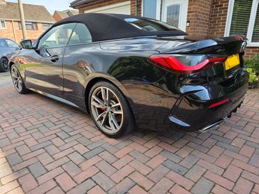 Rear 3/4 view from passenger side of BMW 440i, fully detailed by AM Auto Aesthetics in Salisbury,