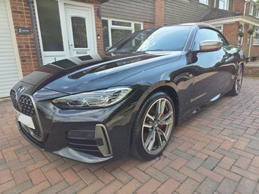 Front 3/4 passenger side of BMW detailed and polished to a mirror finish by AM Auto Aesthetics