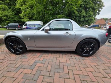 Passenger side of silver Mazda MX5 showing polish and tyre shine
