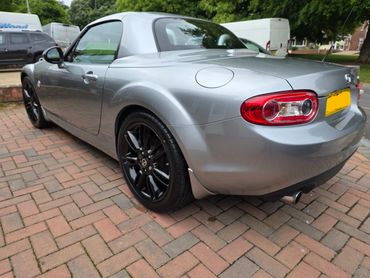Rear 3/4 of silver Mazda MX5 showing paintwork symmetry after detail