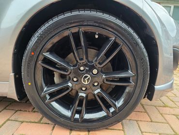 Front wheel and caliper of silver Mazda MX5 cleaned by AM Auto Aesthetics