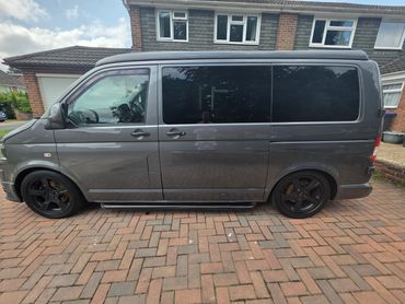 Passenger side of grey VW Camper Van showing polish and tyre shine