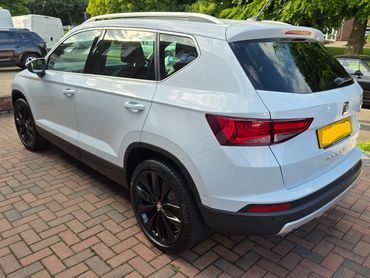 Rear 3/4 of white Seat Ateca showing paintwork symmetry after detail