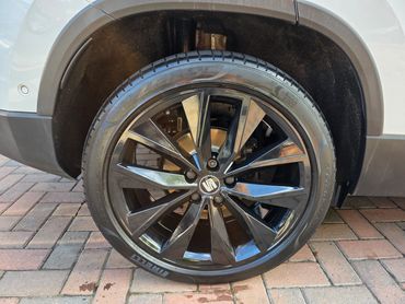 Front wheel and caliper of white Seat Ateca cleaned by AM Auto Aesthetics