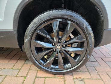 Rear wheel and caliper of white Seat Ateca cleaned by AM Auto Aesthetics